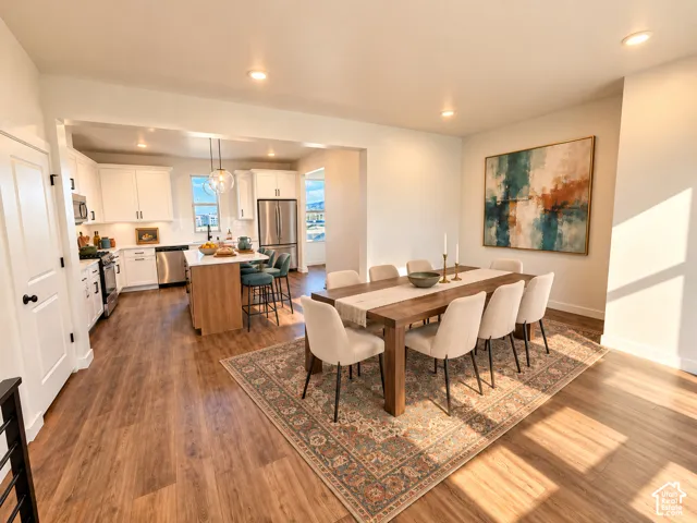 Wood-finish flooring throughout, with a recessed lighting package