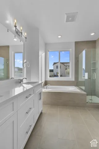 Dual vanity with white cabinetry and quartz countertops