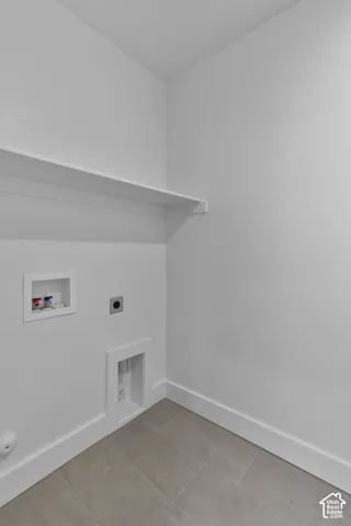 White walls and trim with tile flooring