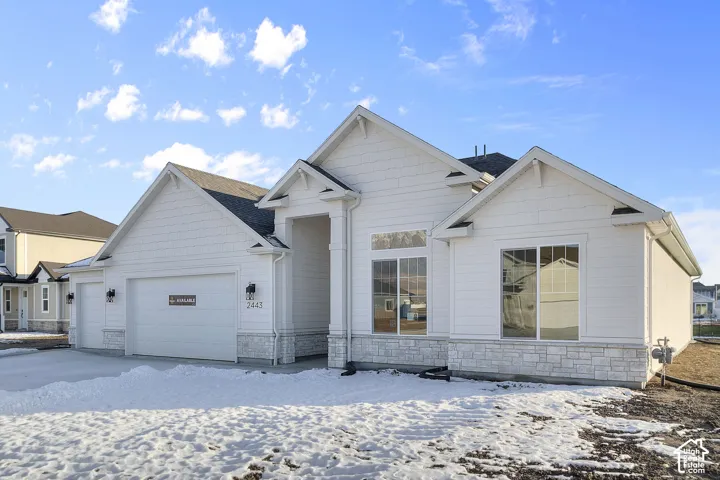 White exterior siding with stone veneer accents
