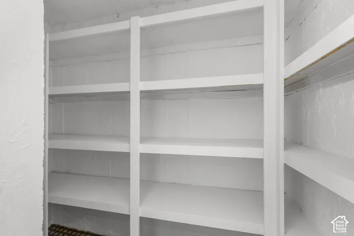 Built-in shelving units with white painted finish