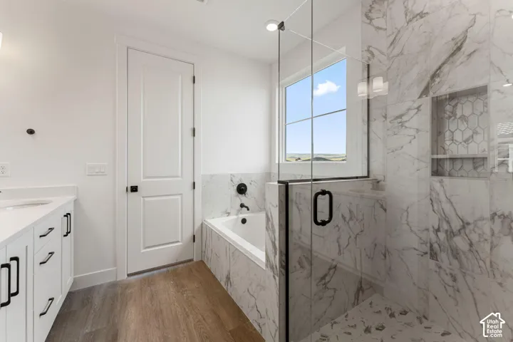 White shaker vanity with quartz countertop and undermount sink