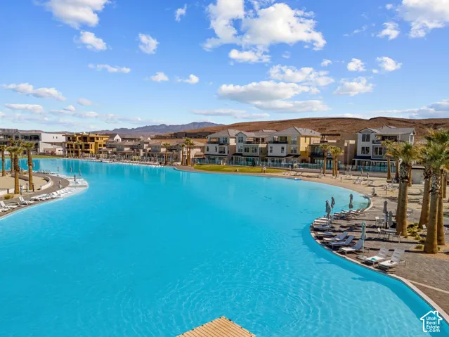 Expansive blue lagoon with surrounding sandy beach areas and multiple residential structures