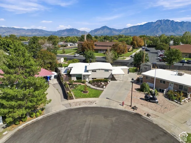 Property on a cul-de-sac with a paved driveway and an attached garage