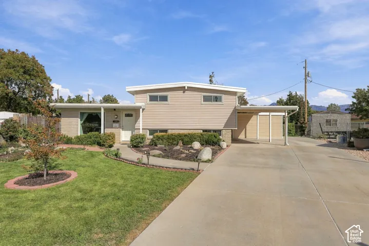 Mid-century modern exterior with horizontal siding and a flat roofline