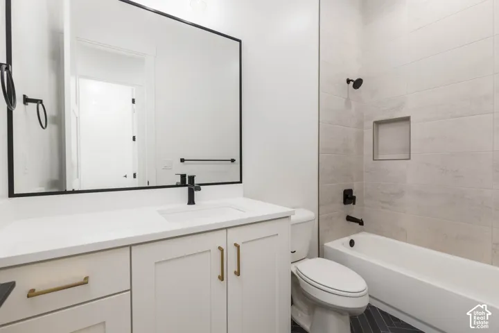 White vanity with solid surface countertop and integrated sink