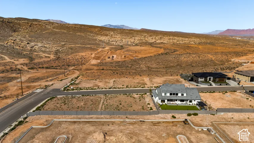 Expansive desert landscape with paved roads and developing residential properties