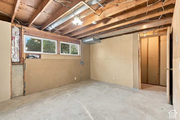 Concrete flooring with exposed ceiling joists