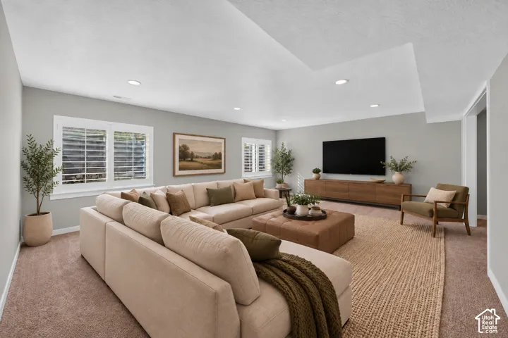 Recessed lighting, light gray wall finishes, dual windows with white plantation shutters, and a drop ceiling detail