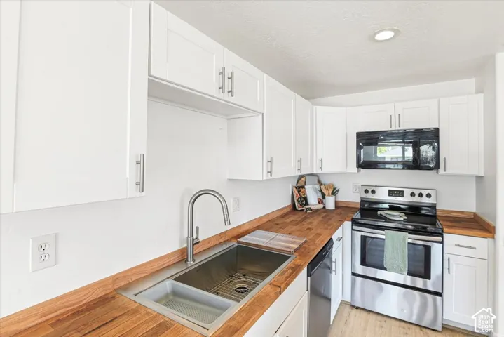 Newly refinished butcher block countertops.