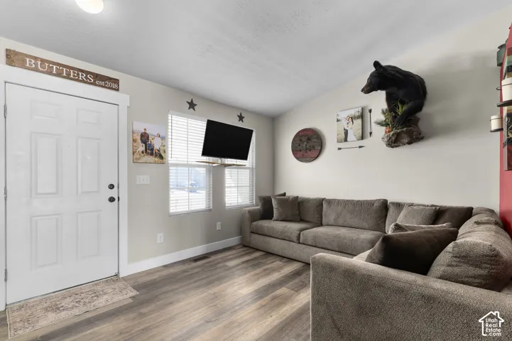 Wood-finish flooring throughout the space