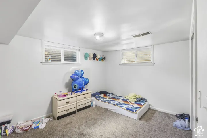 Room 5 located in basement, carpet flooring