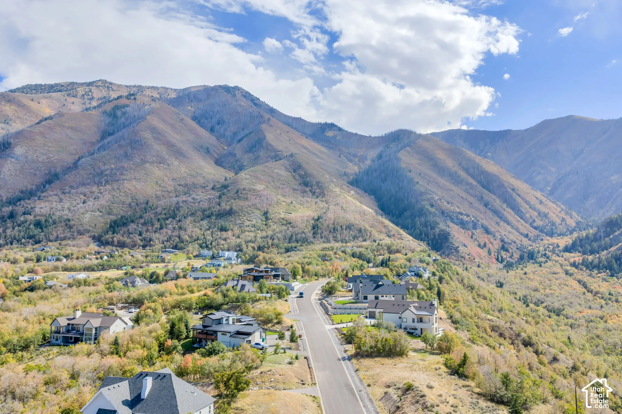 Mountainous terrain with natural vegetation surrounding developed residential areas