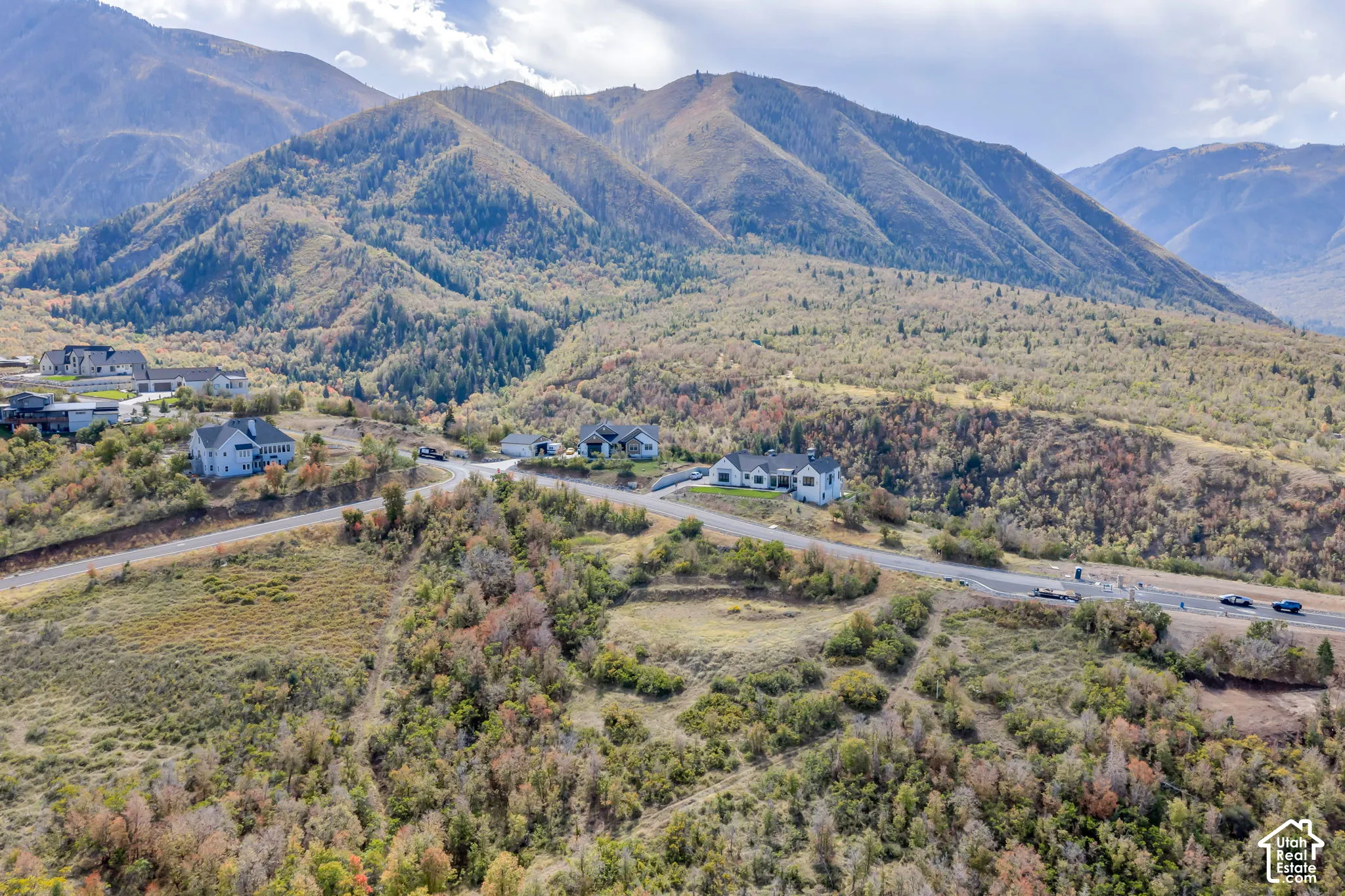 Mountainous landscape with scattered homes and winding roads
