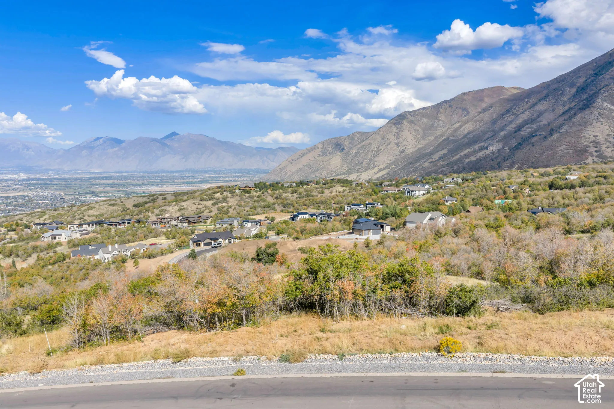 Mountainous terrain with a distant cityscape