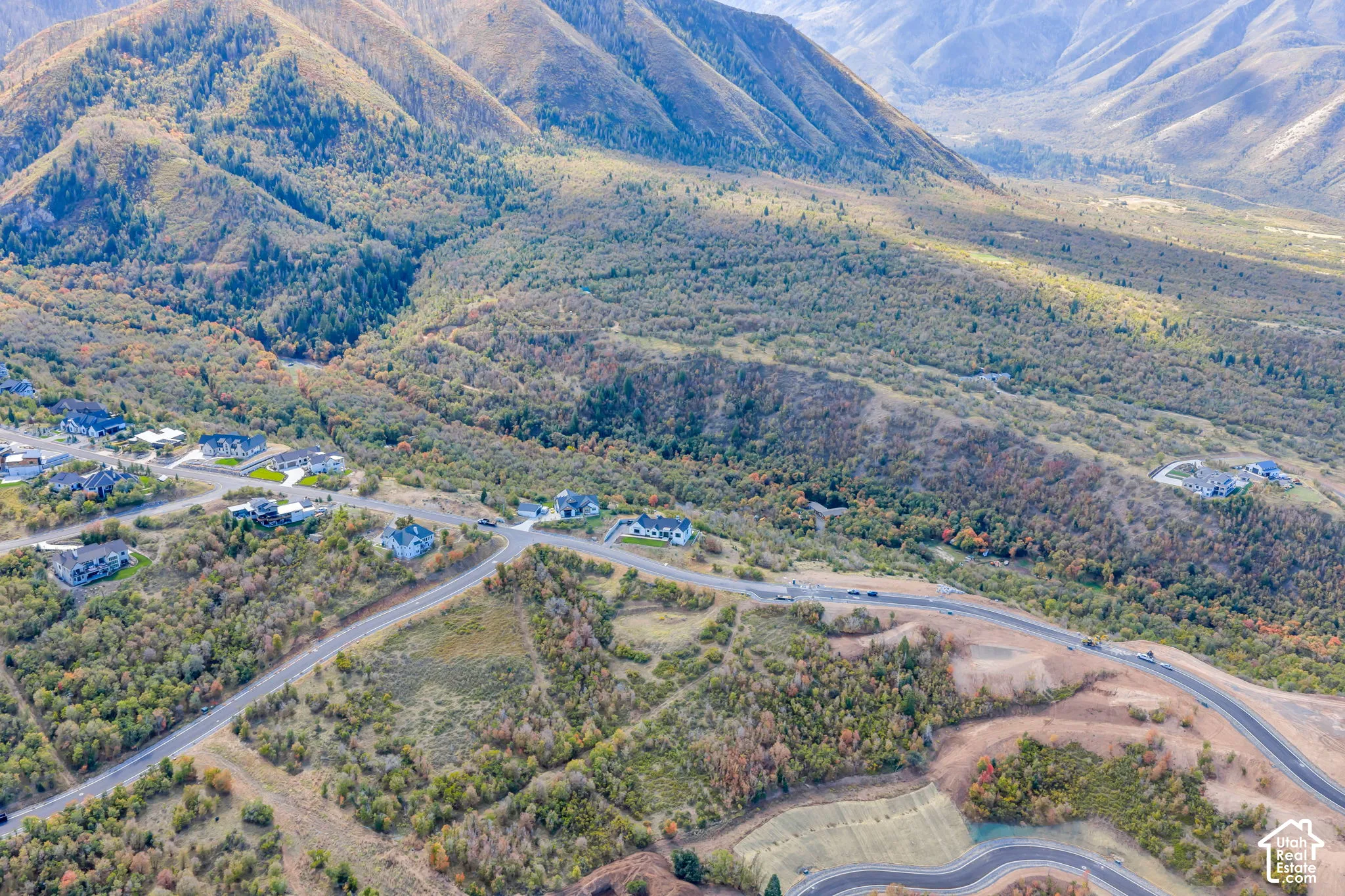 Expansive mountainous terrain with varied vegetation and residential development
