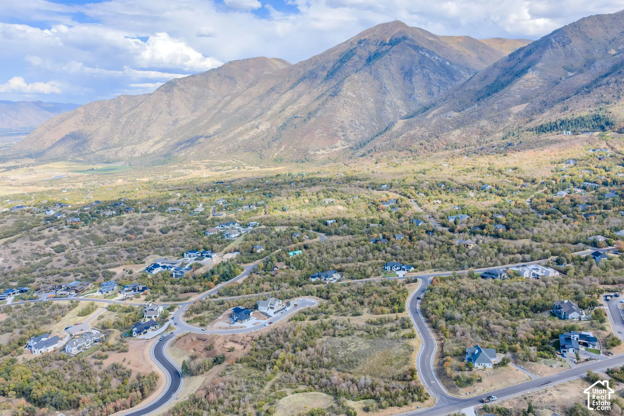 Expansive mountain range backdrop and valley terrain