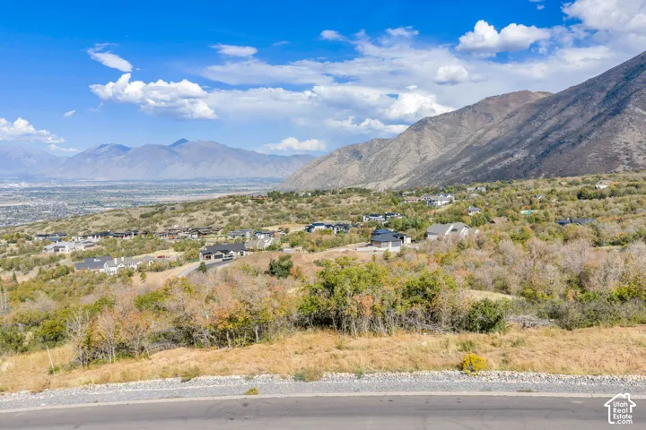 Mountainous terrain with a distant cityscape