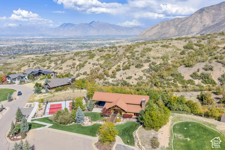 Mountainous backdrop with a residential area in the distance
