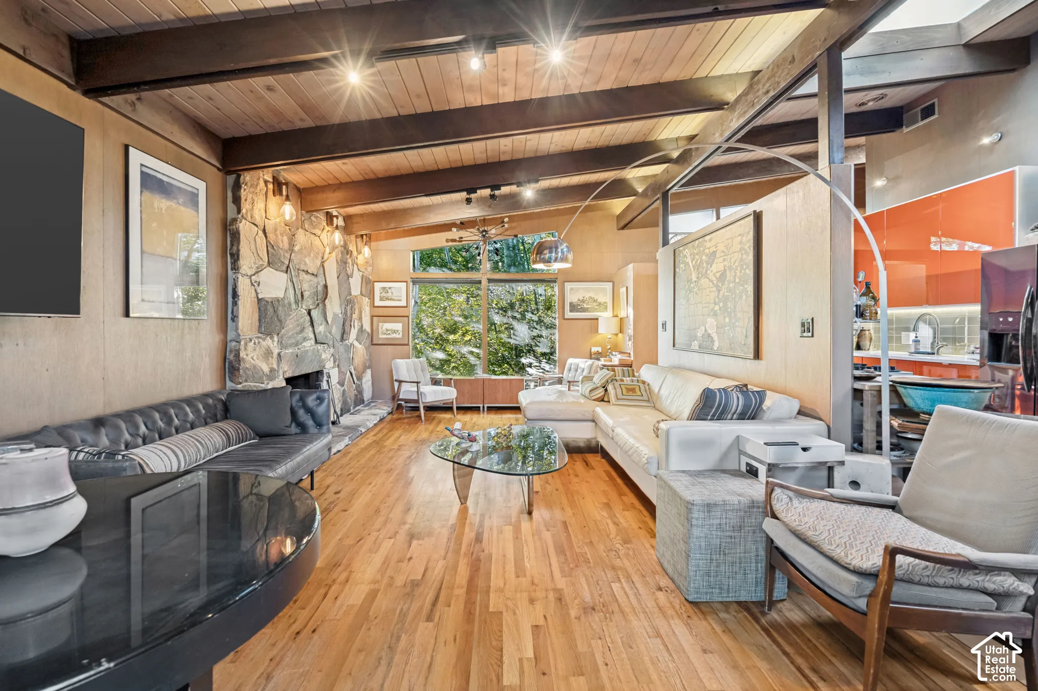 Wood-finish flooring with exposed wood beam ceiling