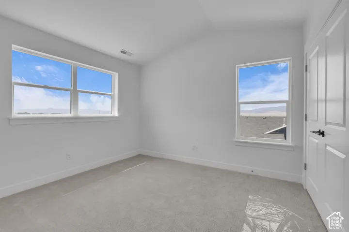 Bedroom with large double door closet. and beautiful mountain views.