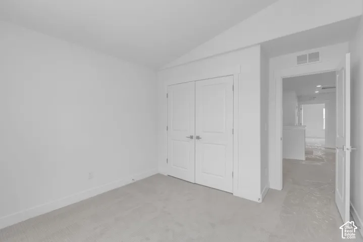 Bedroom with large double door closet.