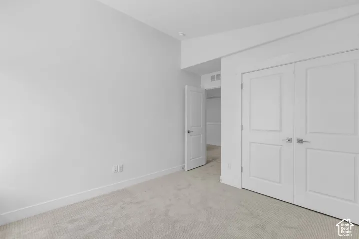 Bedroom with large double door closet.