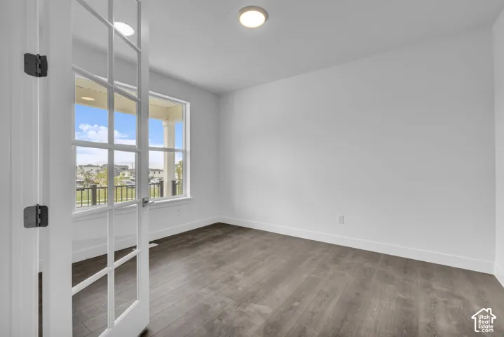 Generous office space featuring French doors with glass panels, and large windows for lots of natural light.