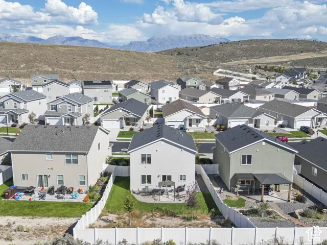 Residential neighborhood with varied home designs and mountain scenery
