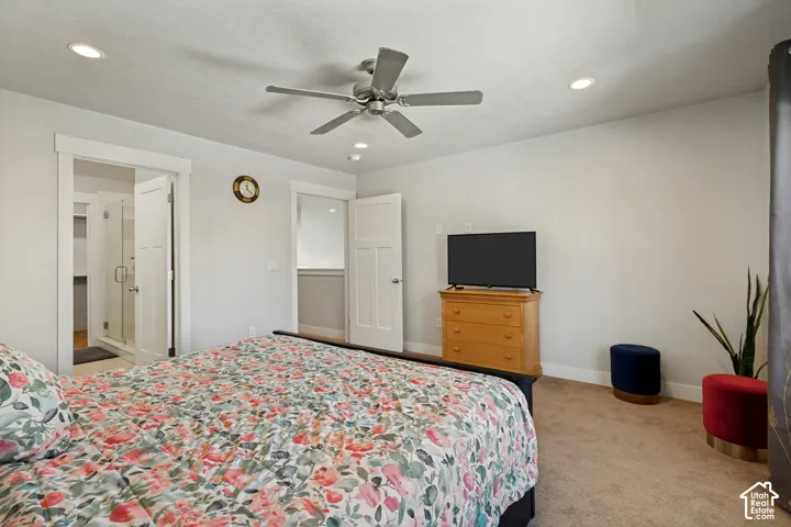 Recessed lighting, ceiling fan, and carpeted flooring