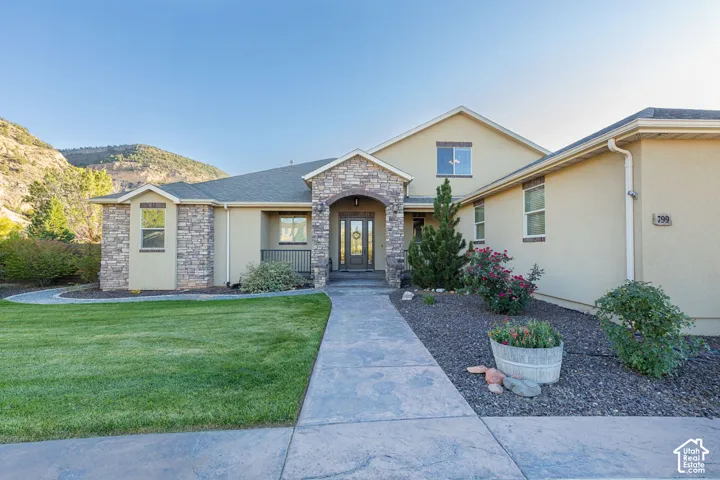 Stone-accented stucco exterior with a covered entry