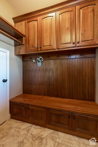 Built-in storage cabinetry with decorative crown molding