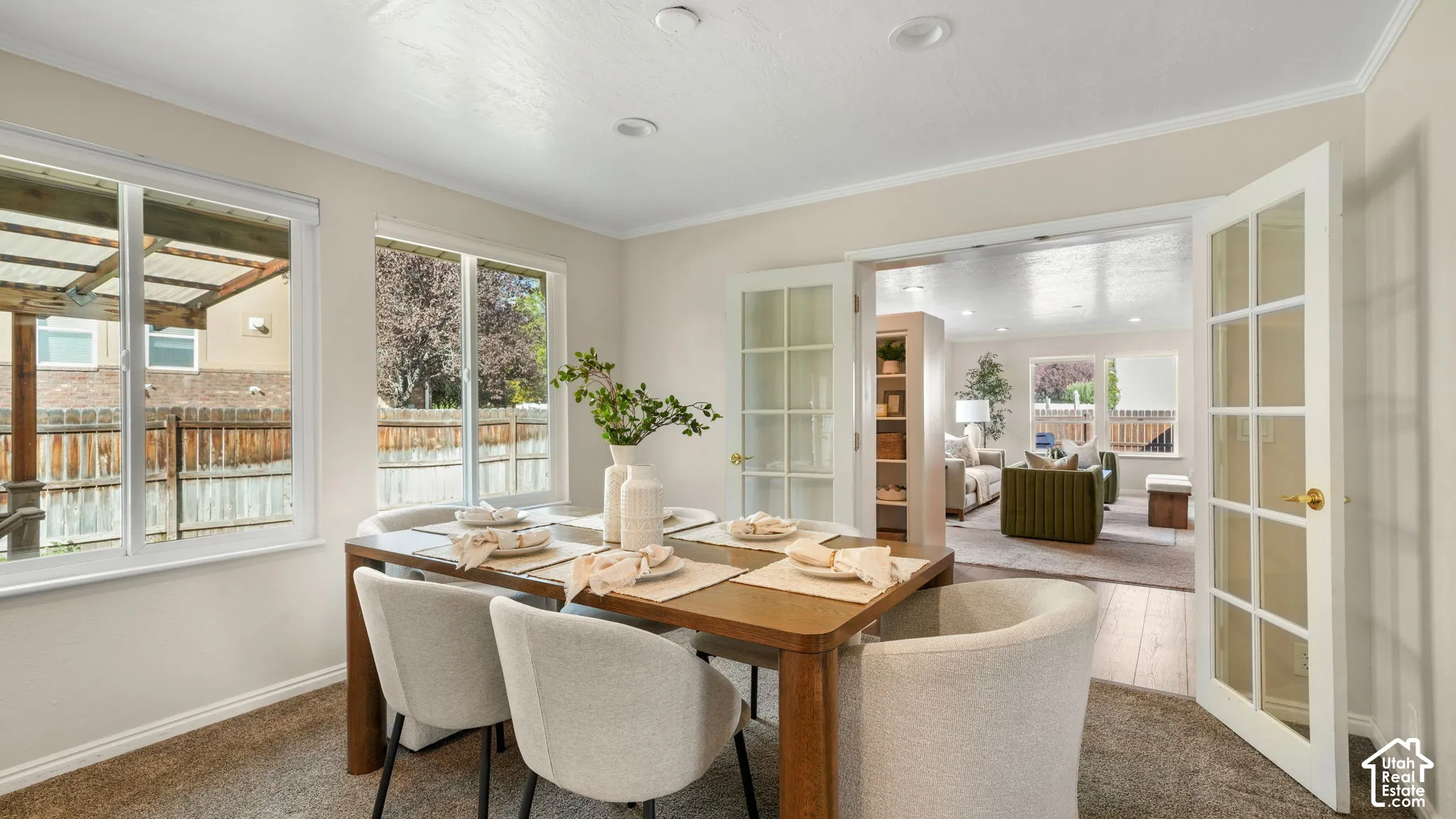 Dining space with recessed lighting, dual windows, and French doors