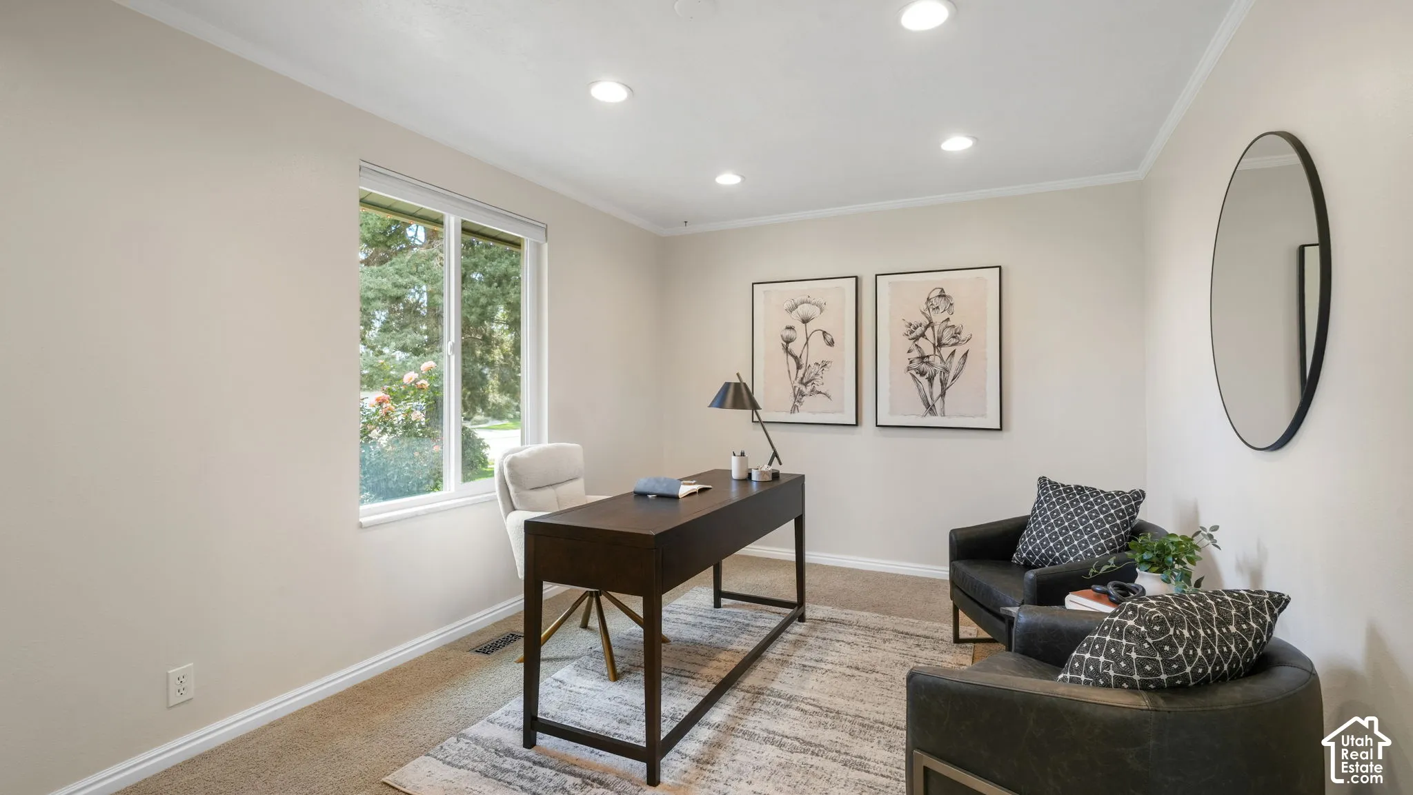 Recessed ceiling lighting, crown molding, and a large window with white trim