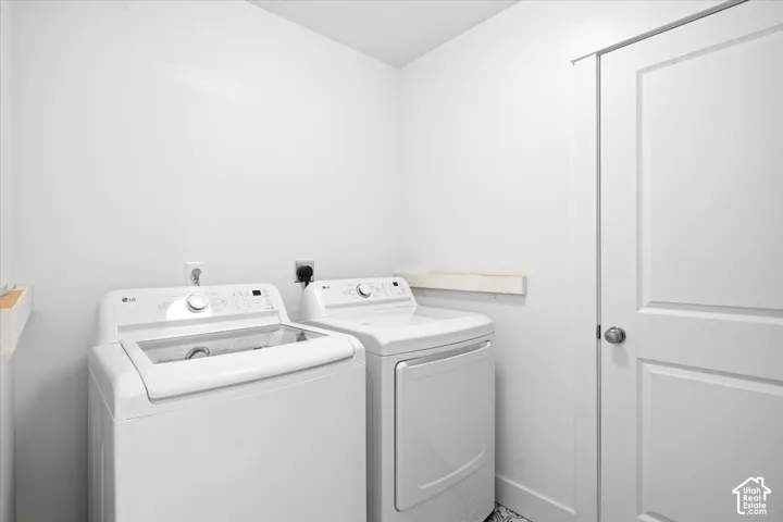 Dedicated laundry area with white walls and a white paneled door