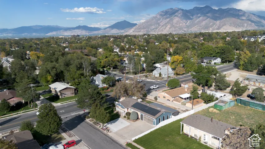Aerial perspective showcasing a residential neighborhood with a prominent mountain backdrop
