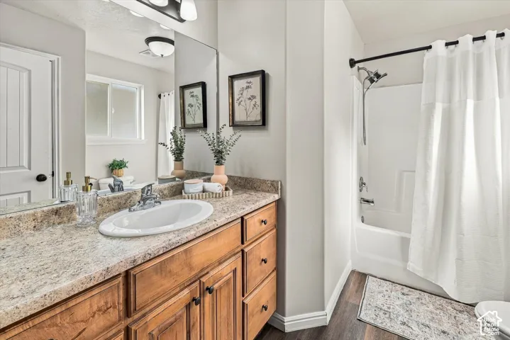 Spacious vanity with an integrated sink, polished chrome faucet, and wood-finish cabinetry