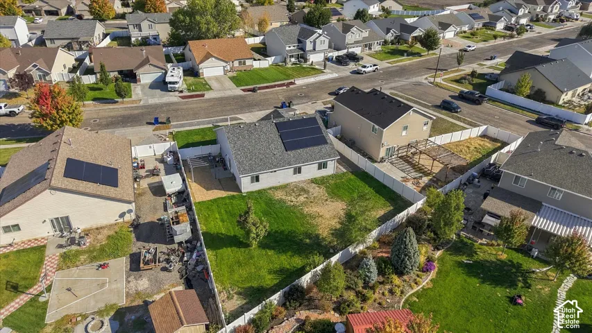 Aerial view from back yard toward home.  Solar panels in view.