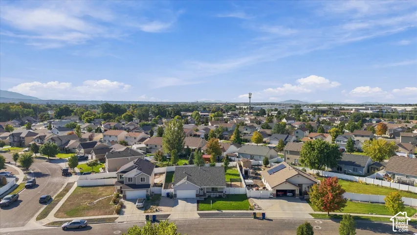 Established residential neighborhood with a mountain backdrop and mature trees