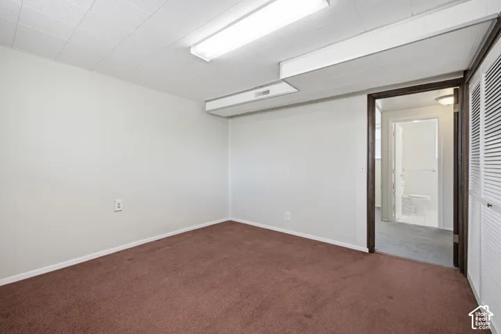 White ceiling panels with integrated fluorescent lighting