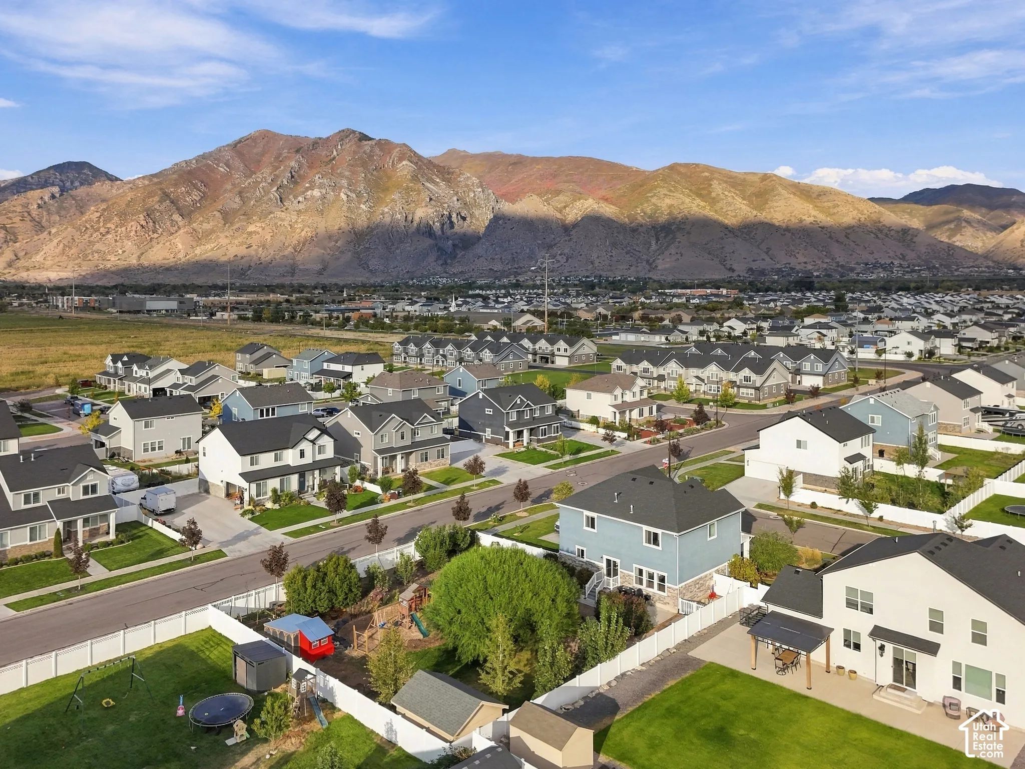Neighborhood with a consistent architectural style, featuring well-maintained streets and sidewalks