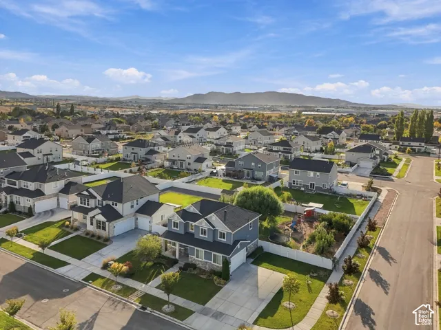 Residential neighborhood featuring detached homes, landscaped properties, and paved streets