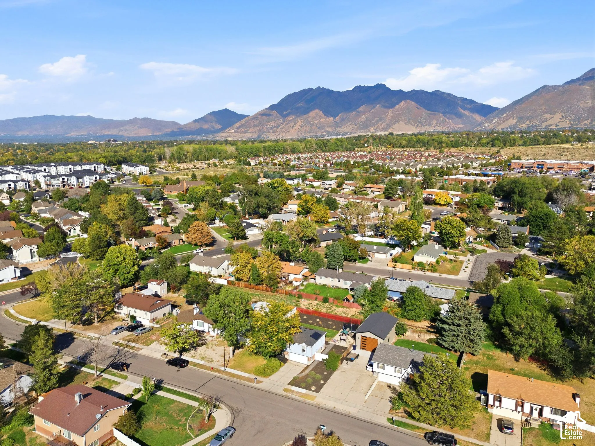 Mountain backdrop with broad valley, residential streets, and mature trees