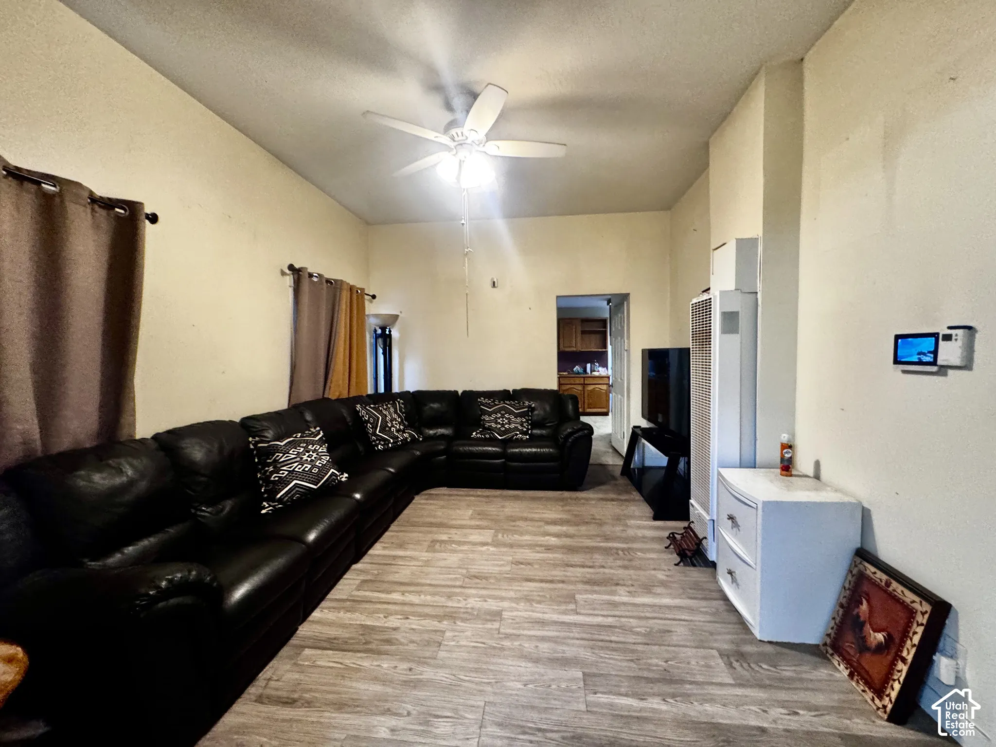 Living area featuring with Vinyl Flooring, ceiling fan, and recessed lighting