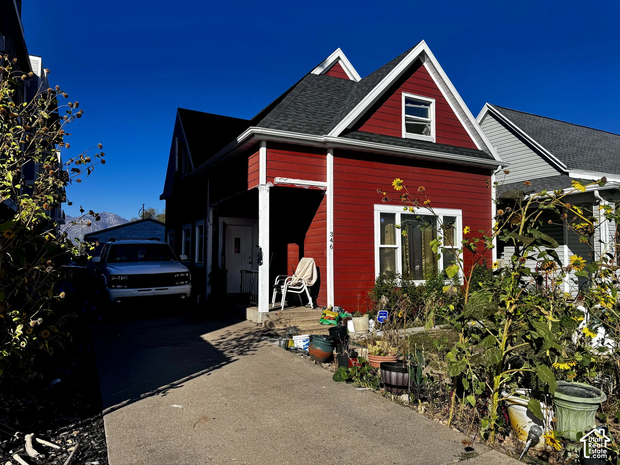 gabled roof, and a paved driveway