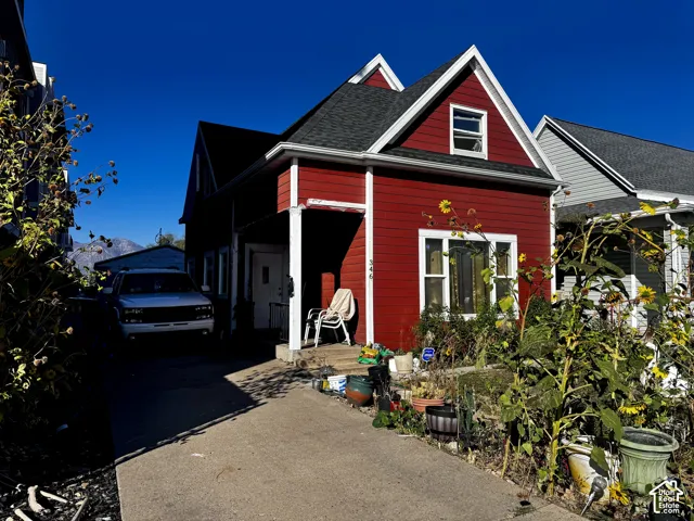 gabled roof, and a paved driveway