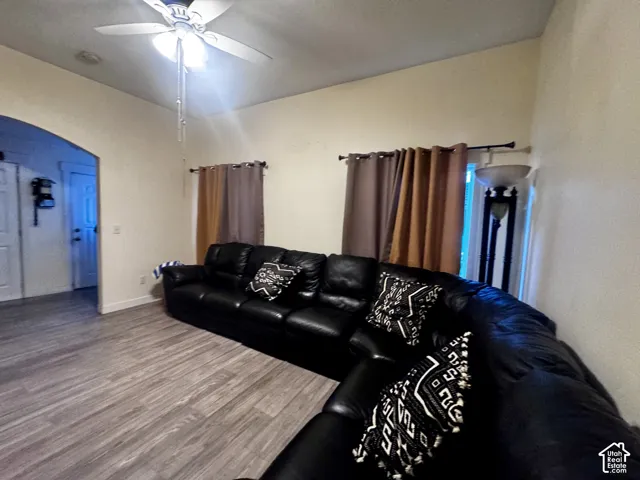 Living area featuring with Vinyl Flooring, ceiling fan, and recessed lighting