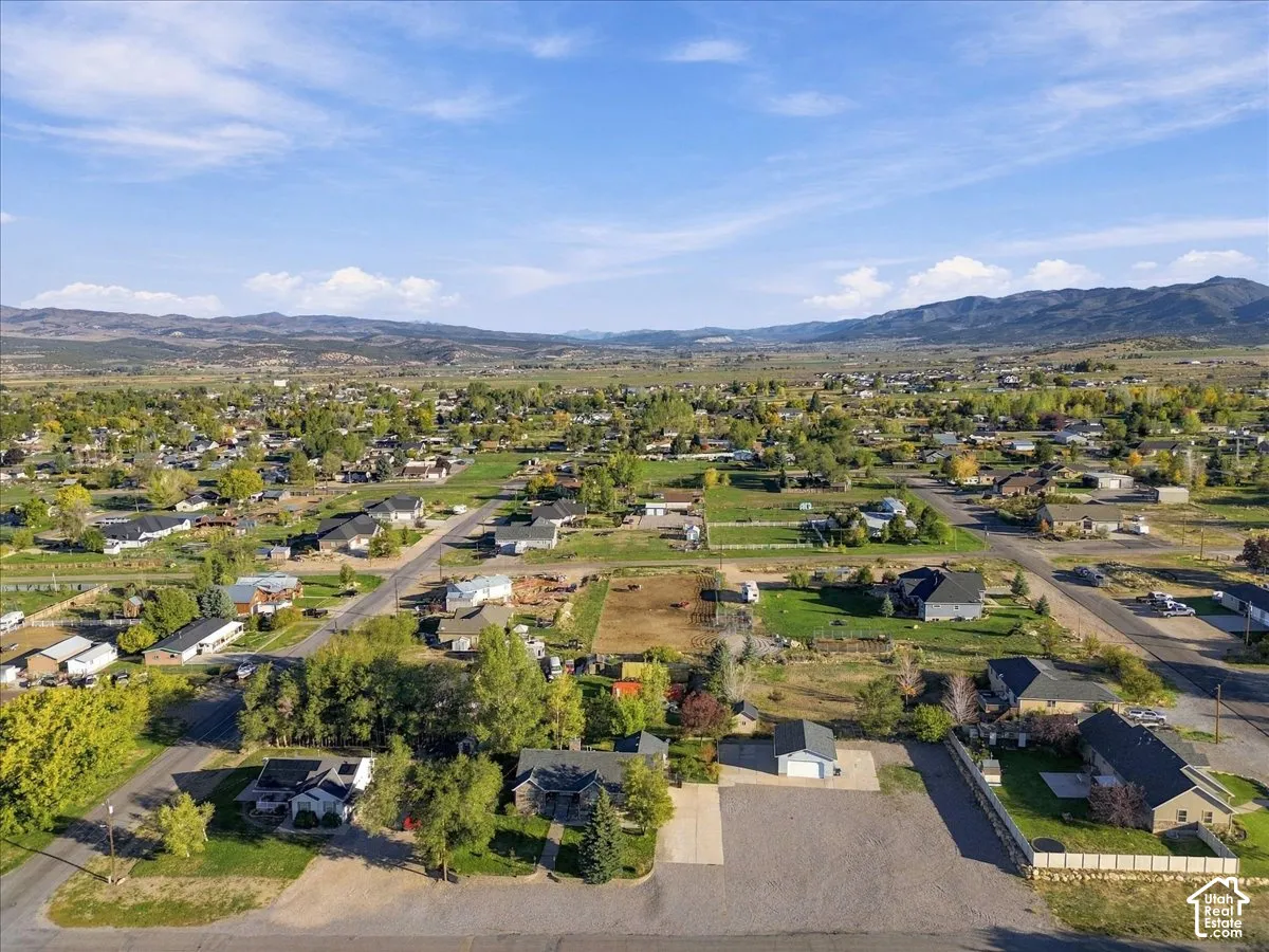 Expansive mountain scenery with residential properties and varied lot sizes
