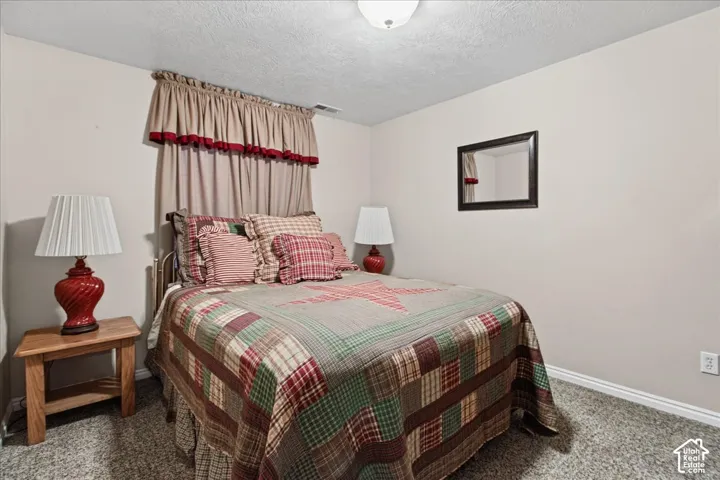 Wall-to-wall carpeting and neutral wall paint