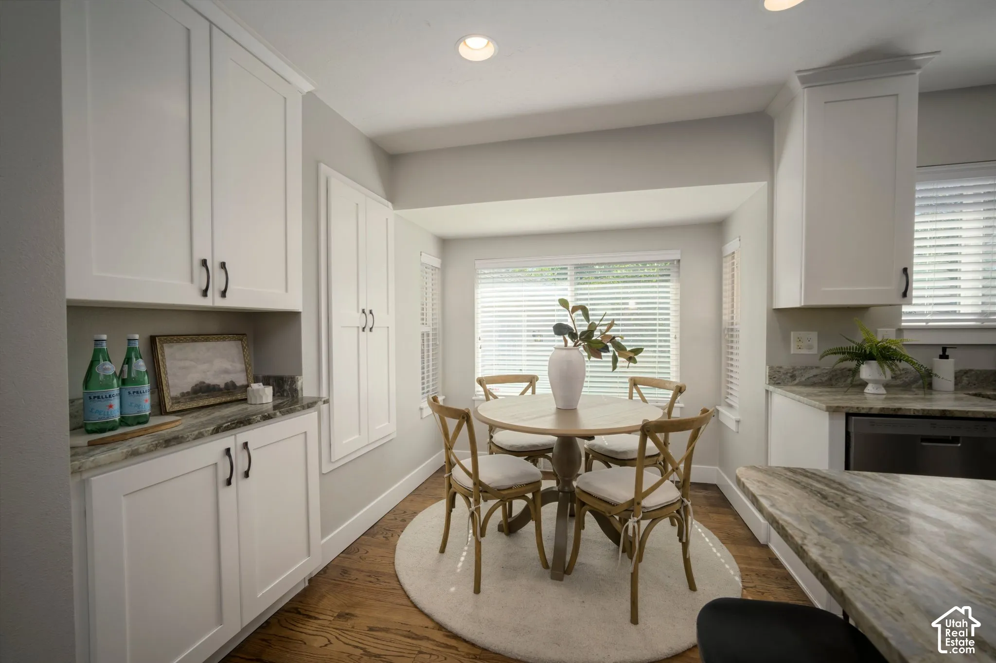 White shaker-style cabinetry with dark hardware
